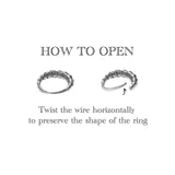 An illustration showing instructions on how to open a wire ring. The text reads: "HOW TO OPEN. Twist the wire horizontally to preserve the shape of the ring." Two images of this Kaya Movement LONA Silver Mandala-Style Septum - Bohemian jewelry are displayed: one intact and another partially twisted open. Available in 1.2mm thickness with diameters of 6mm, 8mm, and 10mm, suitable for nose, tragus, or lobe piercings.