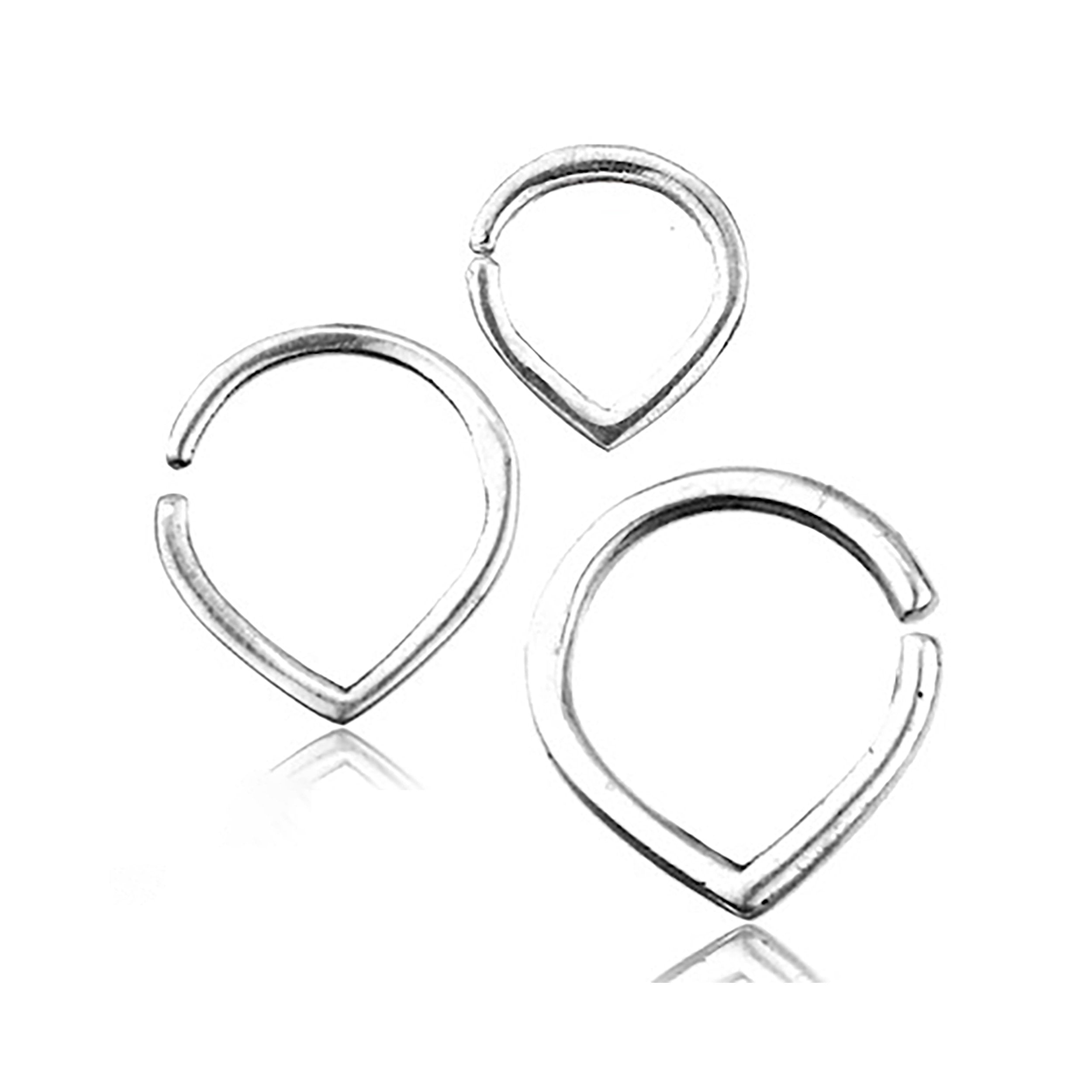 Three varying sizes of the TIKA Simple Teardrop Seamless Rings in Silver by Kaya Movement are positioned on a white background. Each 16 gauge ring, crafted from 925 silver body jewelry, features a smooth, polished finish with a small gap for easy adjustments and wear. The minimalist design is sleek and suitable for multiple piercing applications.