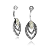 The IBASA Marquise Belly Piercing Ring from Kaya Movement showcases a sophisticated silver design featuring intricate layered teardrops. Each piece is graced with a central marquise-shaped Natural Mother of Pearl stone, suspended from a curved metal rod ending in a sleek sphere. This elegant 14-gauge ring seamlessly blends style and craftsmanship.