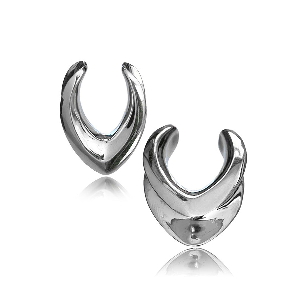 The MYRA Minimalist Saddle Tunnels in Silver by Kaya Movement feature a sleek and modern design with a polished, reflective surface. Displayed against a plain white background, these elegant tunnels range from 10mm to 25mm in gauge and boast a stylish and contemporary appearance due to their symmetrical shape and shiny finish.