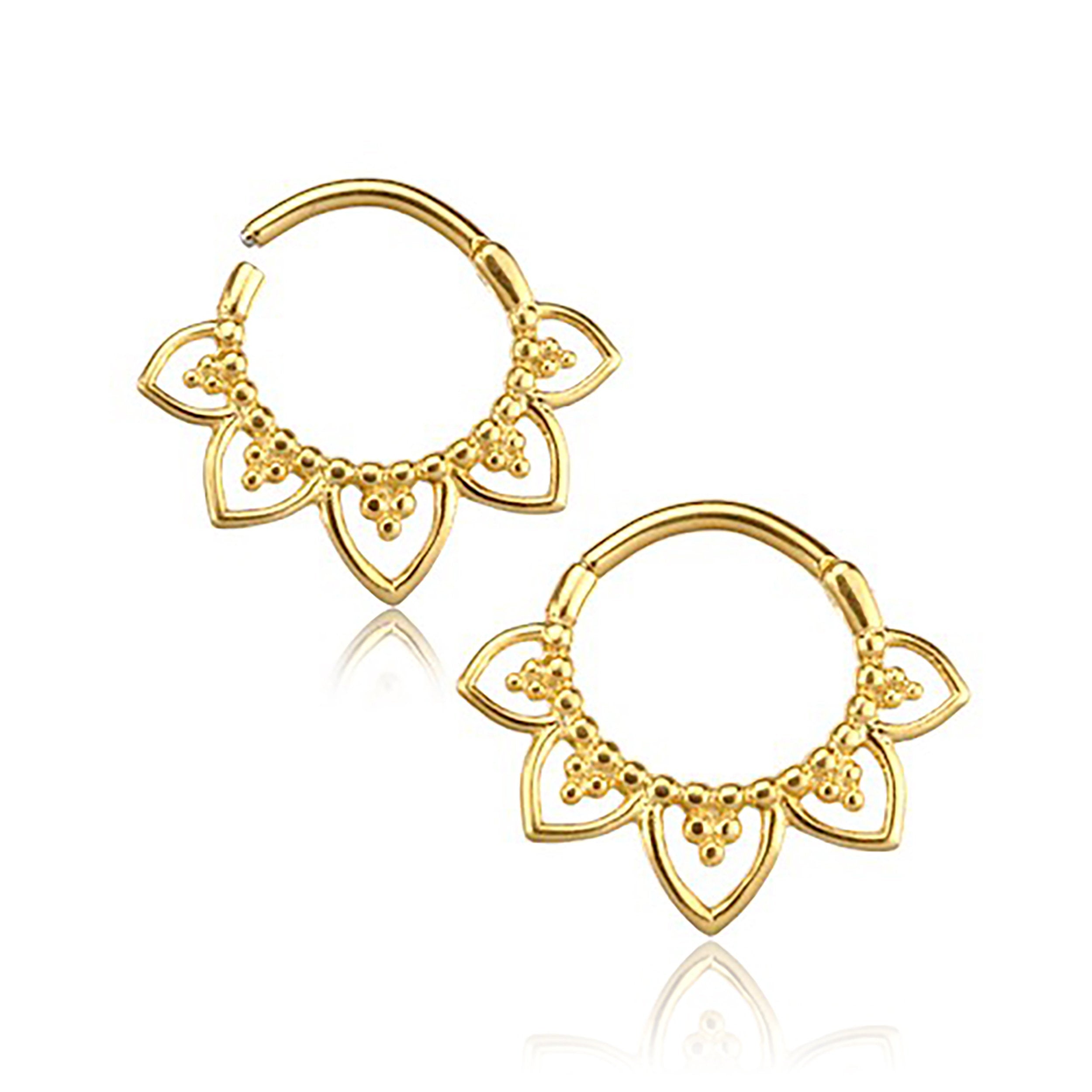 Introducing the MAWAR Lotus Flower Clicker Septum Ring in Gold by Kaya Movement, a stunning piece crafted from 316L Surgical Steel. This elegant 16-gauge ring showcases a floral design with curved petals and intricate beaded details, featuring an open clasp style that adds a sophisticated and ornate touch. The radiant gold finish of this septum ring is beautifully displayed on a plain white background.