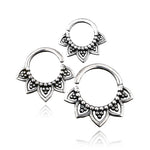 Three intricately designed 16-gauge KAMAL Lotus Flower Rings in 925 silver from Kaya Movement are arranged against a white background. These nose rings feature small, detailed patterns and beaded accents with petal-like embellishments inspired by a tribal ethnic Lotus design, creating a decorative and elegant appearance.