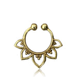 The MAWAR Lotus Fake Septum Ring in Gold by Kaya Movement features an open circular shape with decorative petal-like elements extending from the bottom half. The central area is adorned with small beads, creating an intricate and elegant look against a plain white background.