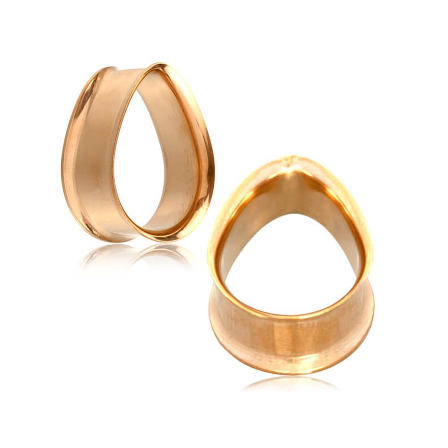 Two Teardrop Tunnel Plugs from Kaya Movement in rose gold, positioned upright and side by side against a white background. These 14 gauge earrings, designed for ear piercings, have a polished finish similar to surgical steel, creating a sleek and elegant appearance.