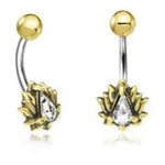 Image of a pair of Kaya Movement's Gold Lotus Flower Belly Rings. Each navel ring features a 9mm curved bar with a small gold ball on one end and a lotus flower design on the other, adorned with a tear-drop shaped clear zircon gemstone in the center.
