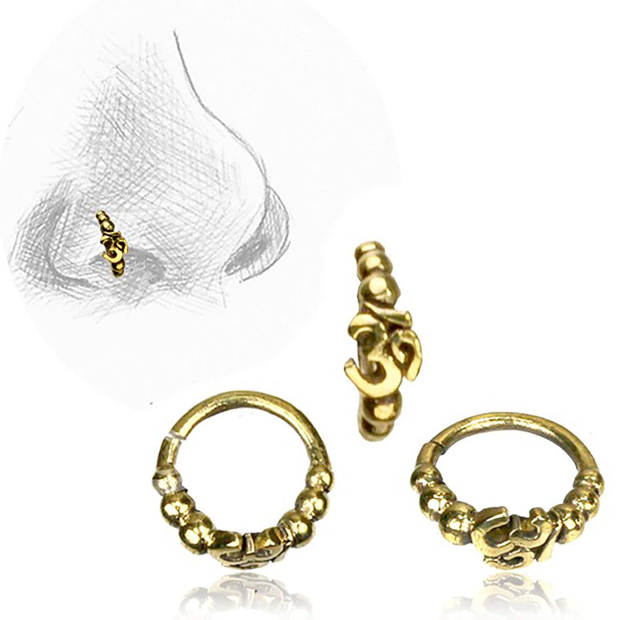 The Lotus Flower Helix Hoop - OM Indian Nose Ring from Kaya Movement is displayed from three different angles. This gold seamless septum jewelry features intricate small beaded decorations and an "OM" symbol at its center. Additionally, a sketched outline of a nose wearing the ring is included in the background, demonstrating how it looks when worn.