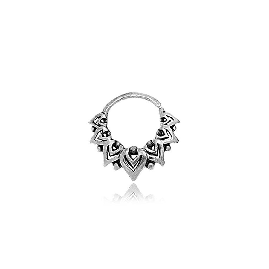 The LONA Silver Mandala-Style Septum from Kaya Movement showcases intricate mandala designs with small black accents forming a triangular pattern around its circular shape. This delicate and detailed piece, perfect for Bohemian fashion enthusiasts, features a convenient small hinge opening for easy insertion. Presented against a white background, the septum ring is available in three diameters: 6mm, 8mm, and 10mm, making it versatile for use as nose jewelry or for the tragus and lobe.