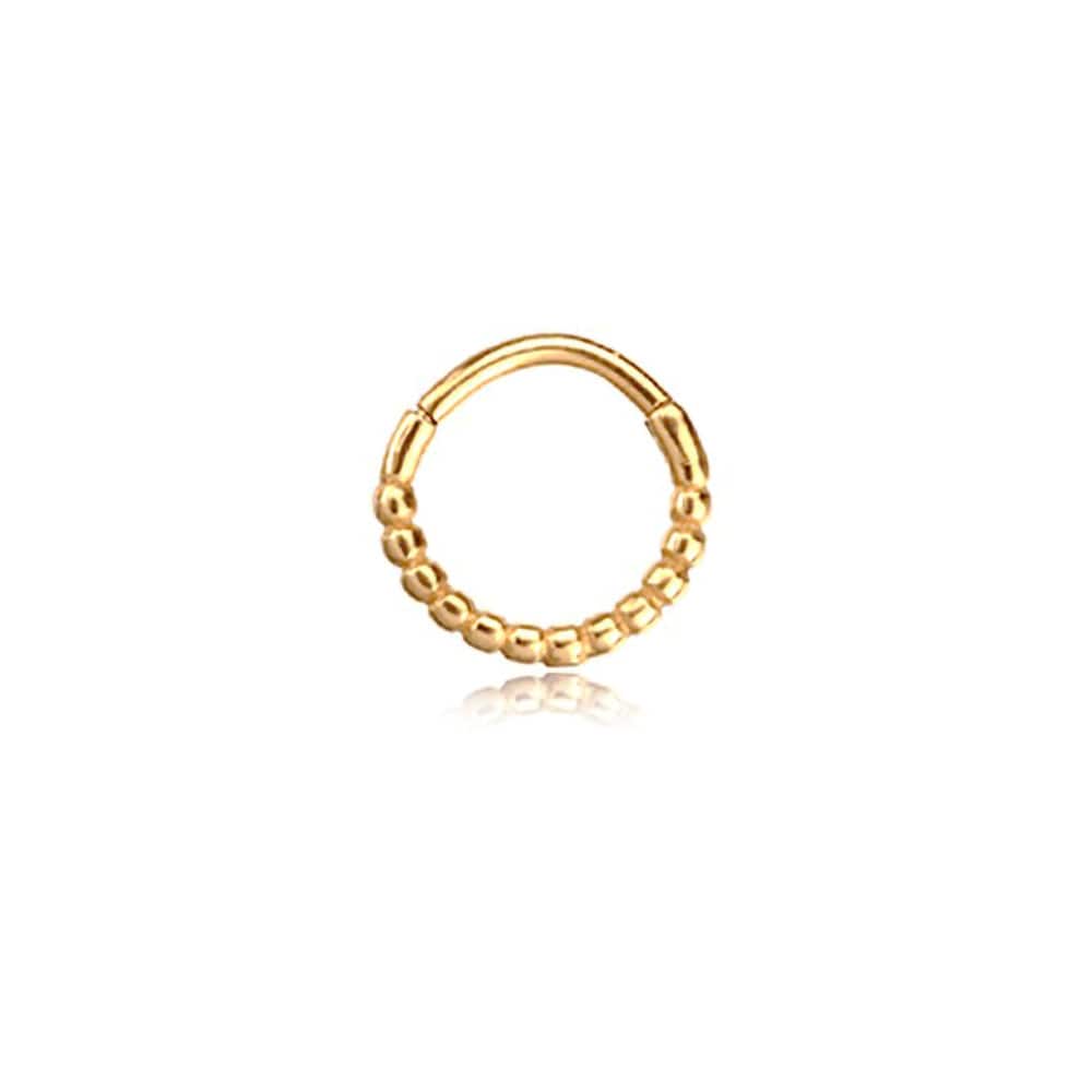 A Lysa Elegant Design Septum by Kaya Movement, featuring gold beads on a seamless circular frame, is displayed against a plain white background. The tiny beads are evenly spaced along the lower half of the stainless steel 316L jewelry, providing a textured appearance.