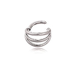 A minimalist gold PVD septum ring, branded "Trion" by Kaya Movement, showcases a triple-ring design crafted from 316L steel. The nose jewelry features a sleek, semi-open form with each ring subtly curving and layered in a rounded and stacked effect. The smooth, polished finish provides a modern and elegant touch that echoes minimalist design principles.