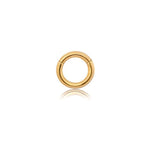 A small, golden hoop earring with a smooth Gold PVD finish by Kaya Movement is displayed against a plain white background. The "Aurel Simple Ear Ring" in 316L steel captivates with its minimalist elegance and subtle hinge closure at the top. The bottom of the hoop, available in gauges of 2 or 3mm and diameters ranging from 8 to 14mm, gently reflects the light.