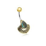 The Kaya Movement's Lumi Navel Jewelry showcases a unique boho ethnic drop design, featuring a semi-circular metallic base with intricate patterns, a central teardrop-shaped blue-green abalone stone, and a curved barbell adorned with a gold sphere on one end. Handcrafted from surgical steel, this piece is perfect for any free-spirited fashionista looking to embrace festival style.