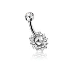 Introducing the Sira Navel Piercing by Kaya Movement, showcasing a sleek geometric silver design. This stunning belly button ring features a curved barbell adorned with dazzling zircon gemstones at each end. The larger gemstone is encircled by an exquisite floral-like pattern of petite silver beads, making it a striking choice for navel piercings. With a 10mm length and 1.6mm gauge (14g), it truly embodies modern brilliance.