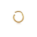 The Kaya Movement's Lysa Elegant Design Septum ring, crafted from stainless steel 316L and finished with a gold PVD coating, showcases a partially open circular shape. The 1.2mm thick ring, measuring 8mm in diameter, features tiny bead-like designs that cover three-quarters of its surface, while the remaining one-quarter is smooth metal. This subtly shiny piece of septum jewelry is displayed on a white background for everyday elegance.