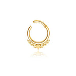 The Starry Bohemian Septum in 316L Gold PVD Steel "Astria" by Kaya Movement features a small loop design with a decorative celestial pattern. At the bottom of the ring, you'll find a row of small circular accents and a central star-shaped charm, perfectly capturing the essence of septum jewelry. This exquisite piece has an elegant 1.2mm gauge and an 8mm diameter, all showcased on a plain white background.