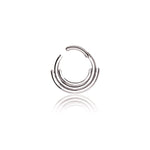 The Lira Minimalist Boho Chic Septum in 316L Steel silver Finish by Kaya Movement features three concentric semicircular hoops stacked together with an opening at the top, creating modern-day elegance. This refined silver Bohemian jewelry piece has a 1.2mm gauge and an 8mm diameter, beautifully reflecting light on the white background below it.