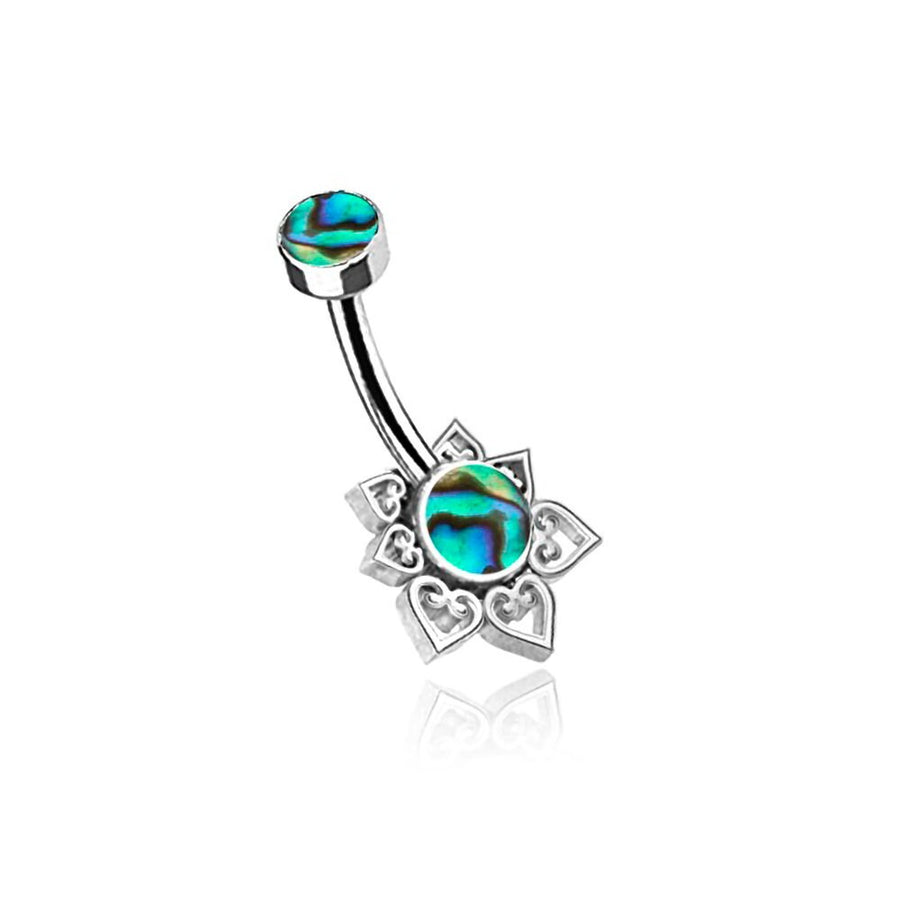 The Kaya Movement Mandara Navel Piercing - a boho-chic mandala belly jewel - features a discreet, hypoallergenic steel barbell with abalone shell accents. The top end displays a small round abalone shell, while the bottom end boasts a larger round abalone shell surrounded by an ornate flower-shaped design with heart patterns, making it the perfect accessory for boho-chic style.