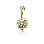 The Kaya Movement's Zane 1.6mm Navel Piercing boasts a brilliant gold finish and is lavishly embellished with seven sparkling zircon gemstones. Its design showcases a central large gemstone encircled by smaller ones, forming an elegant flower-like pattern, while another clear zircon adorns the top of the curved bar, making it perfect for any navel piercing.