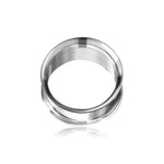 A close-up of a shiny, metallic Zura Tunnel by Kaya Movement, crafted from 316L surgical steel with a hollow center and slightly flared edges, resembling a large silver ear plug. The object is positioned upright against a plain white background, casting a subtle reflection and enhancing its minimalist design charm. Available in 5mm, 14mm, 16mm, and 18mm sizes.