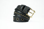 The ITO Punk Rock Men's Black Studded Leather Belt by Kaya Movement is displayed against a white background. Perfect for dystopian festival wear, the edgy belt features gold spike details, a shiny gold buckle, multiple holes near the end, and stitching along the edges for an industrial punk rock vibe.