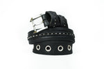 The Kaya Movement ITO Punk Rock Men's Black Studded Leather Belt with silver spikes and multiple metal grommet eyelets is displayed against a plain white background. The industrial punk rock belt features stitched details along its length, creating an edgy and stylish look.